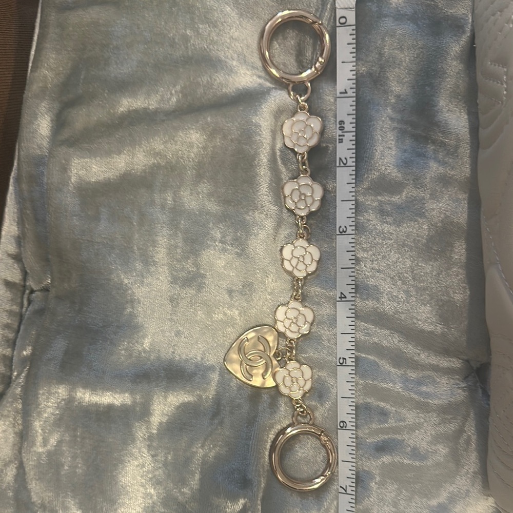 White Floral Keychain with Gold Accents